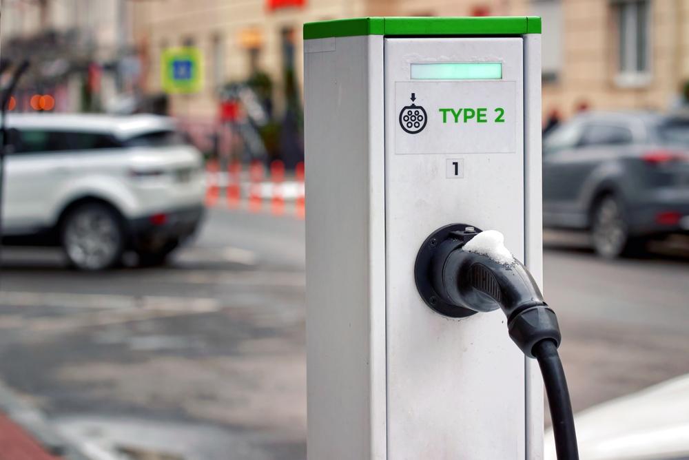 Renting an EV vehicle in Iceland EV charger type two on a white and green charging station