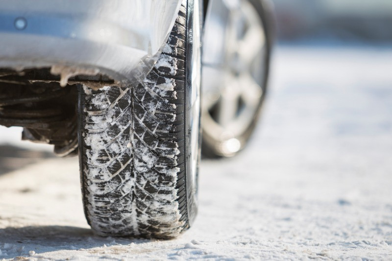 Up close image of a car with winter tires in Iceland