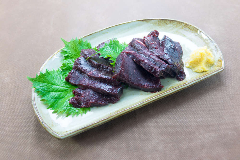 Whale meat served on a plate raw
