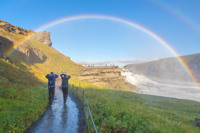 two travelers heading to visit Gullfoss waterfall