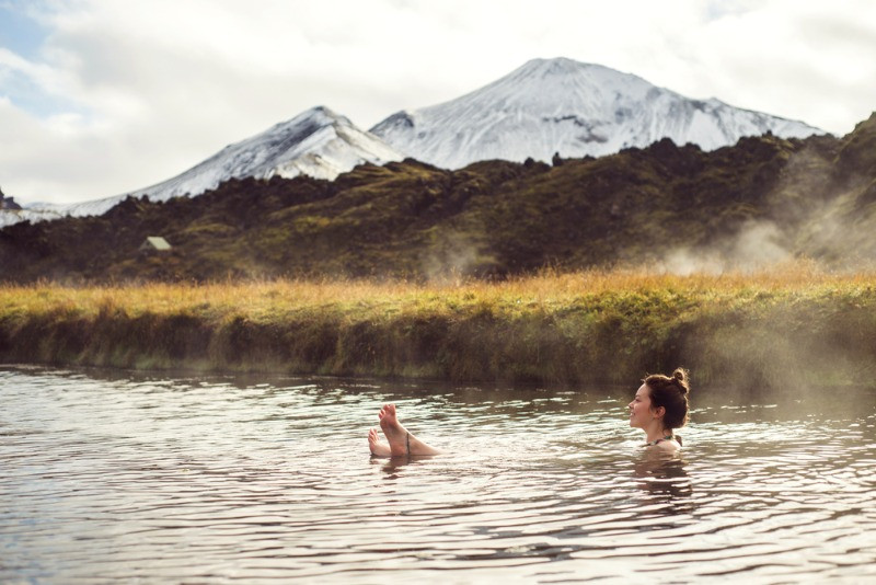 woman relaxing at Landmannalaugar hot springs
