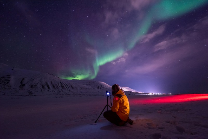 photographer hunting for the northern lights in Iceland