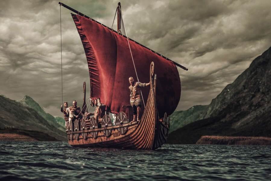 Viking ship ploughing through the cold waters of the North Atlantic ocean