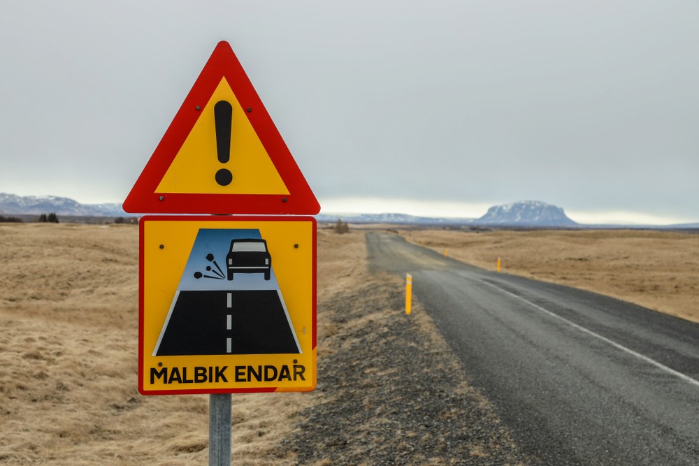Iceland road sign that advise of gravel roads