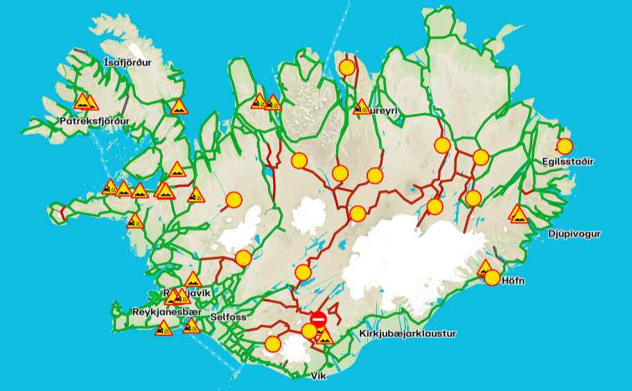 Road conditions in Iceland Map of Iceland showing road conditions with green and red routes, warning signs, and closed sections.