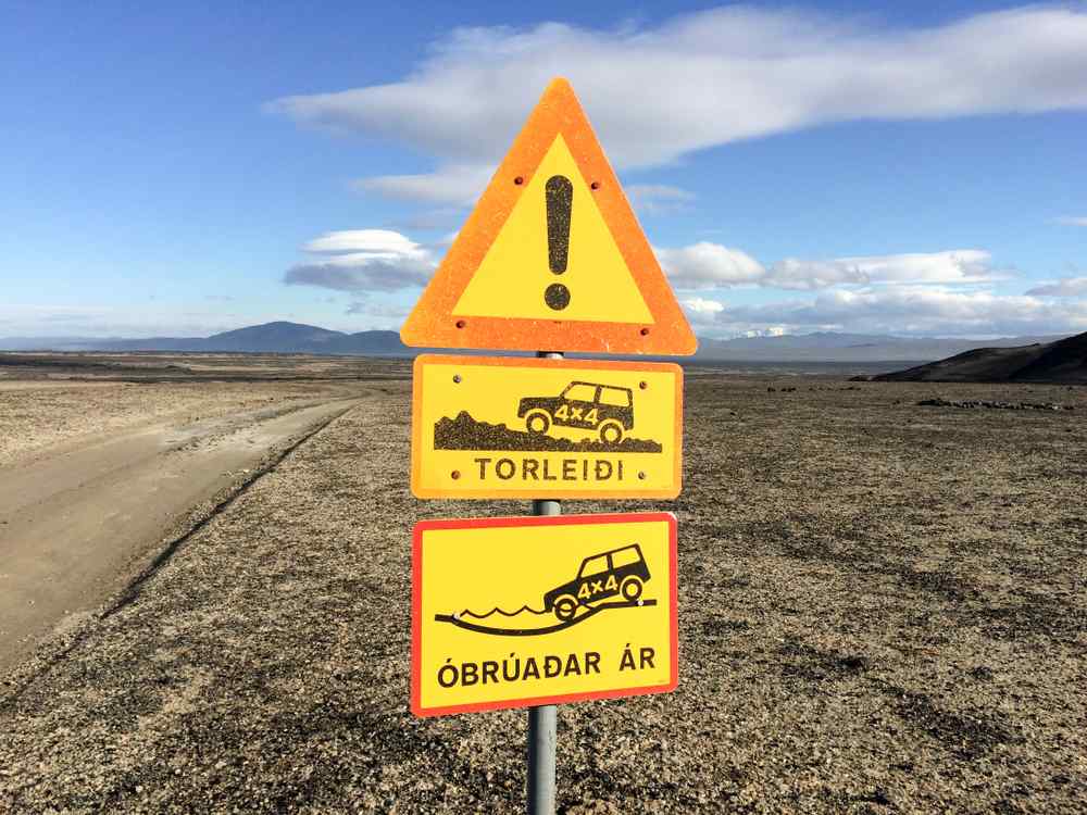 Road signs on Iceland's F-roads Icelandic warning sign for rough 4x4 roads and unbridged rivers in the Highlands.