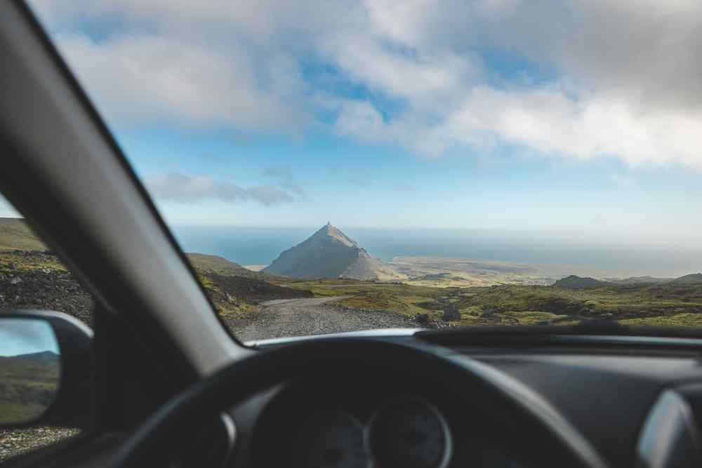 Iceland's Snaefellsnes View from inside a car overlooking a remote Icelandic coastal landscape near Snæfellsnes.