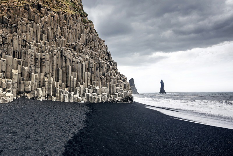 View of the basalt columns and the black sand of Reynisfjara