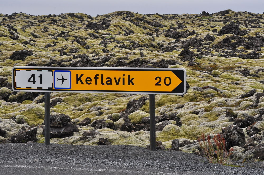 Yellow traffic sign showing the way to Keflavik Airport 