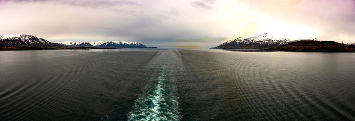 Iceland cruise liner sailing through a fjord