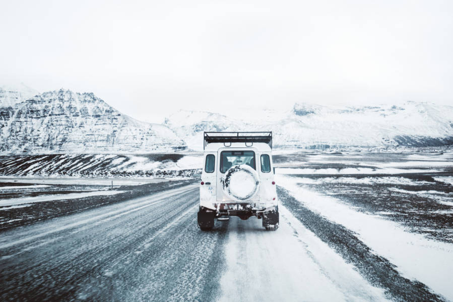 Jeep on an icy and snowed road in Iceland