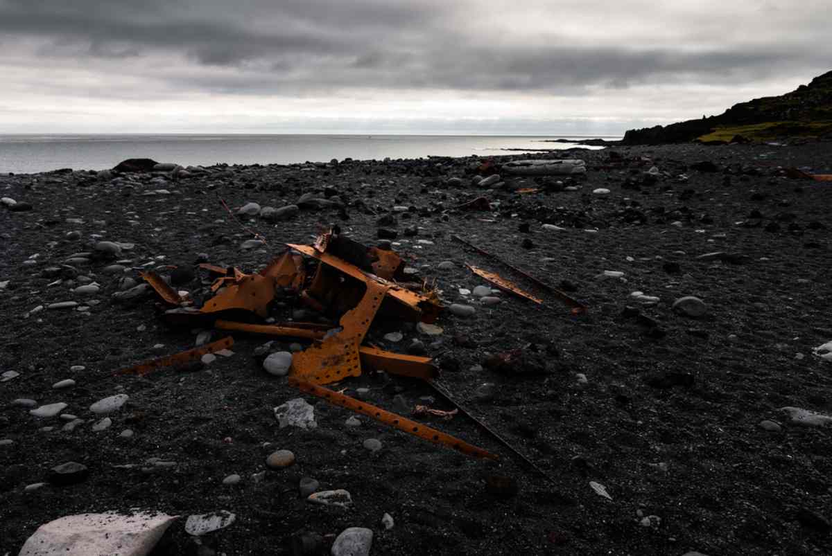 Plane remains at black sand beach