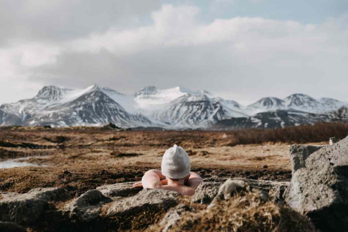 Girl bathing at the secret lagoon in Iceland