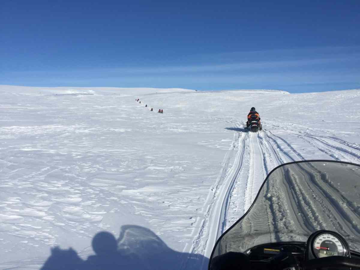 Group practicing snowmobiling on Langjokull glacier