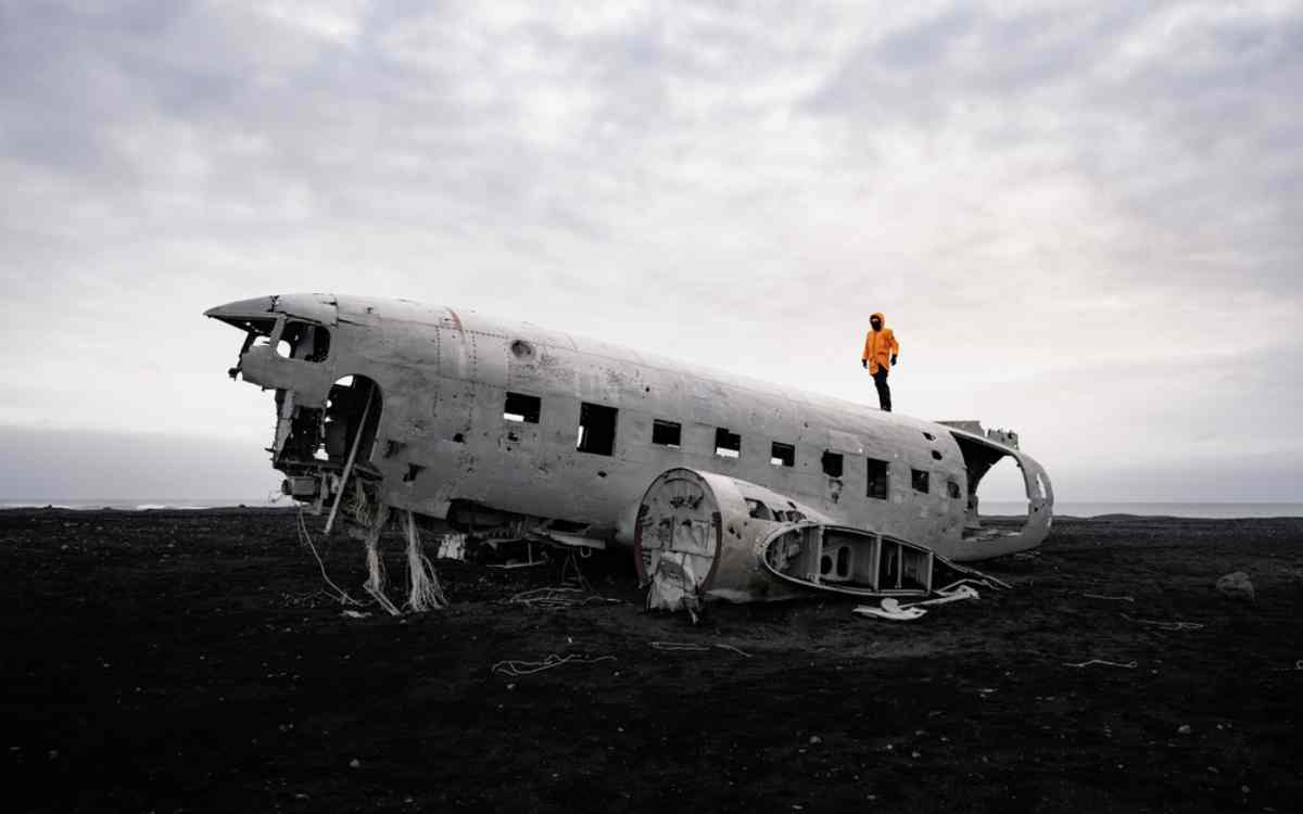 Toourist standing on top of the DC-3 wreck