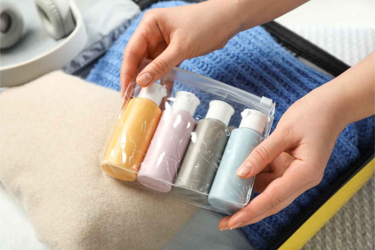 Plastic zip bag with bottles for shampoo, conditioner and cream