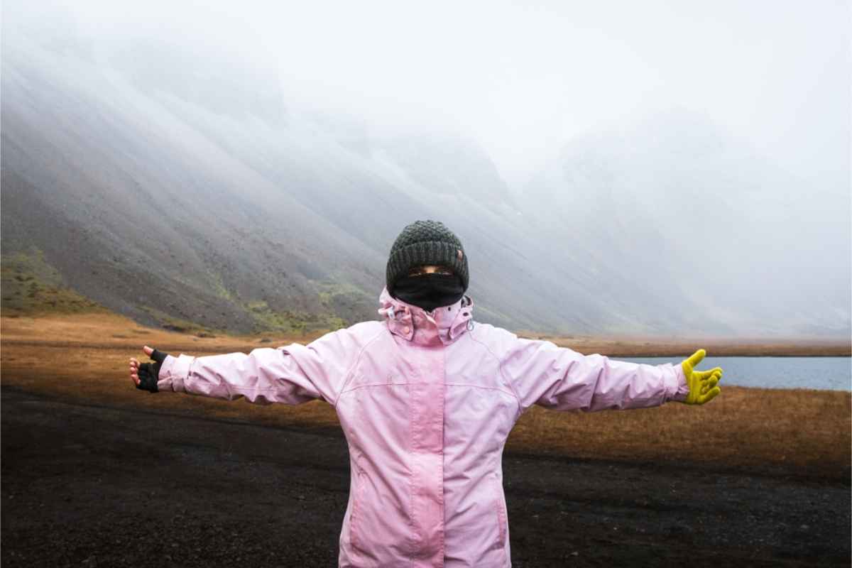 Woman all covered up in her waterproof jacket, beanie and neck gaiter