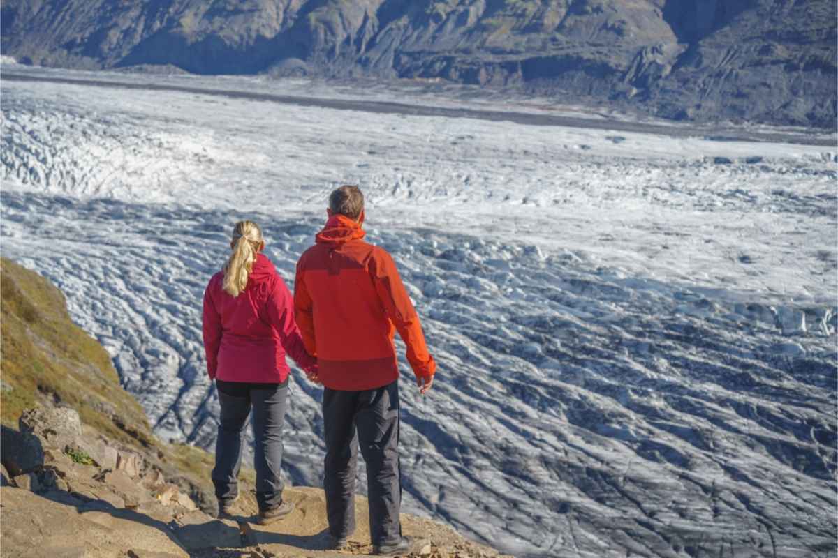 Couple enjoying the impressive views of Vatnajokull glacier
